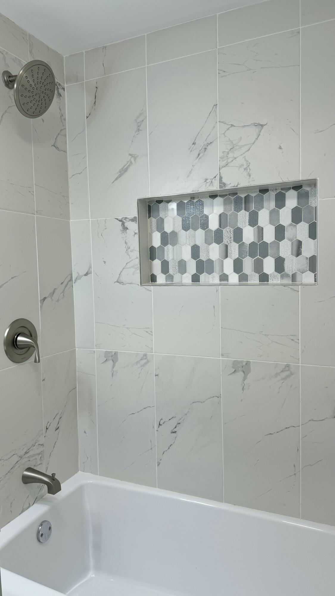 2926 State Street Lake Station, IN 46405 - Photo 12 of 16 a bathroom with a bathtub