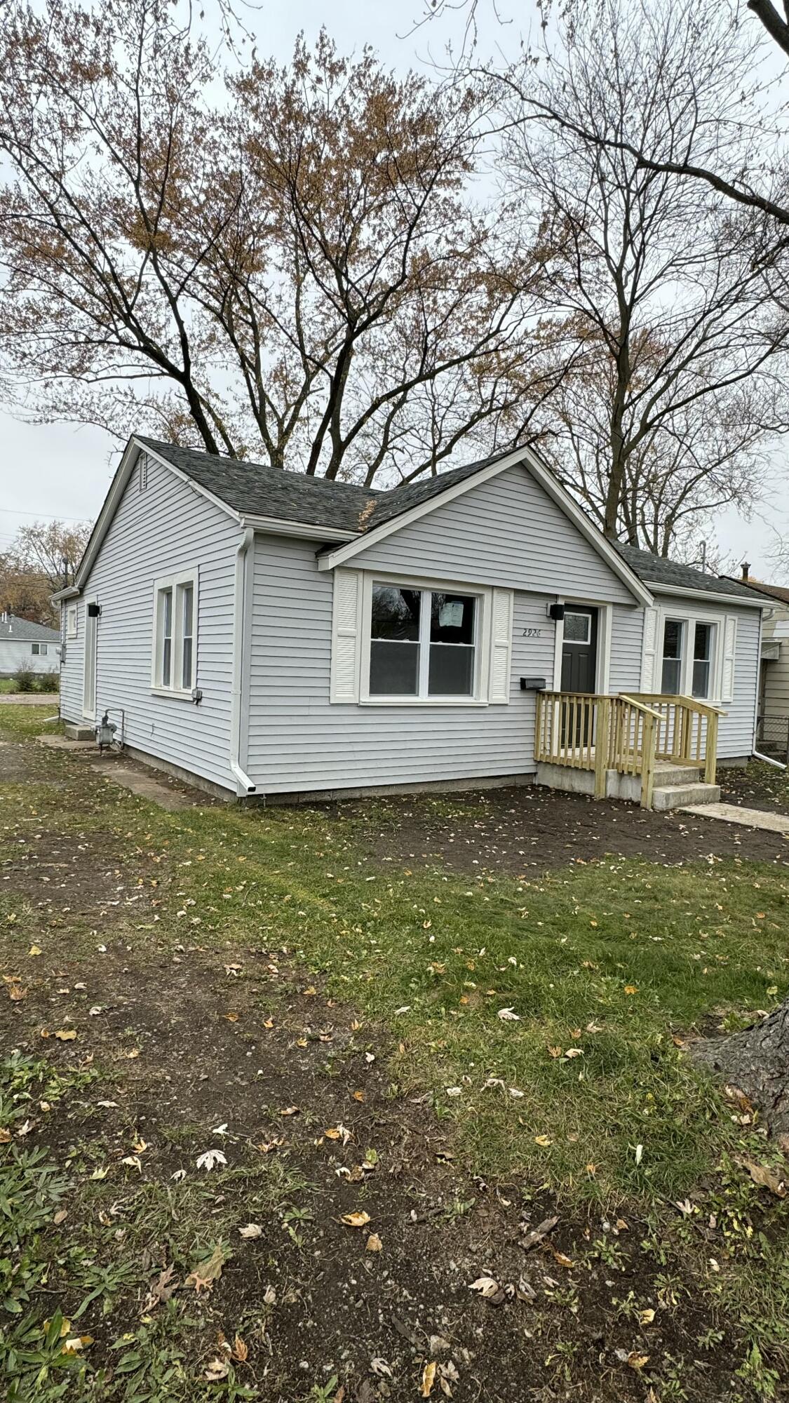2926 State Street Lake Station, IN 46405 - Photo 2 of 16 a front view of a house with a garden