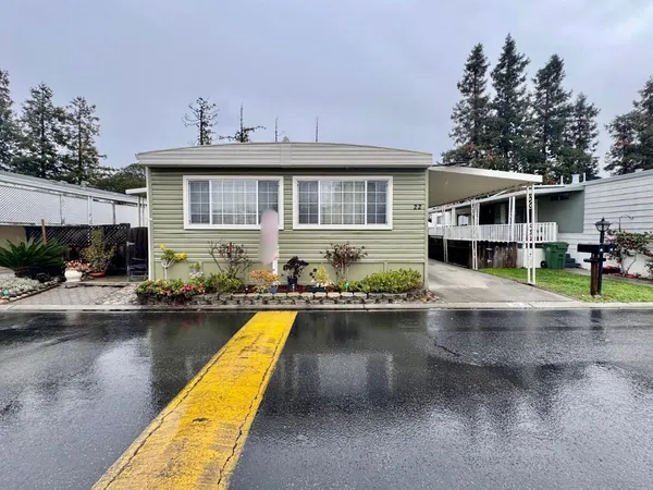 a view of a house with swimming pool and sitting area