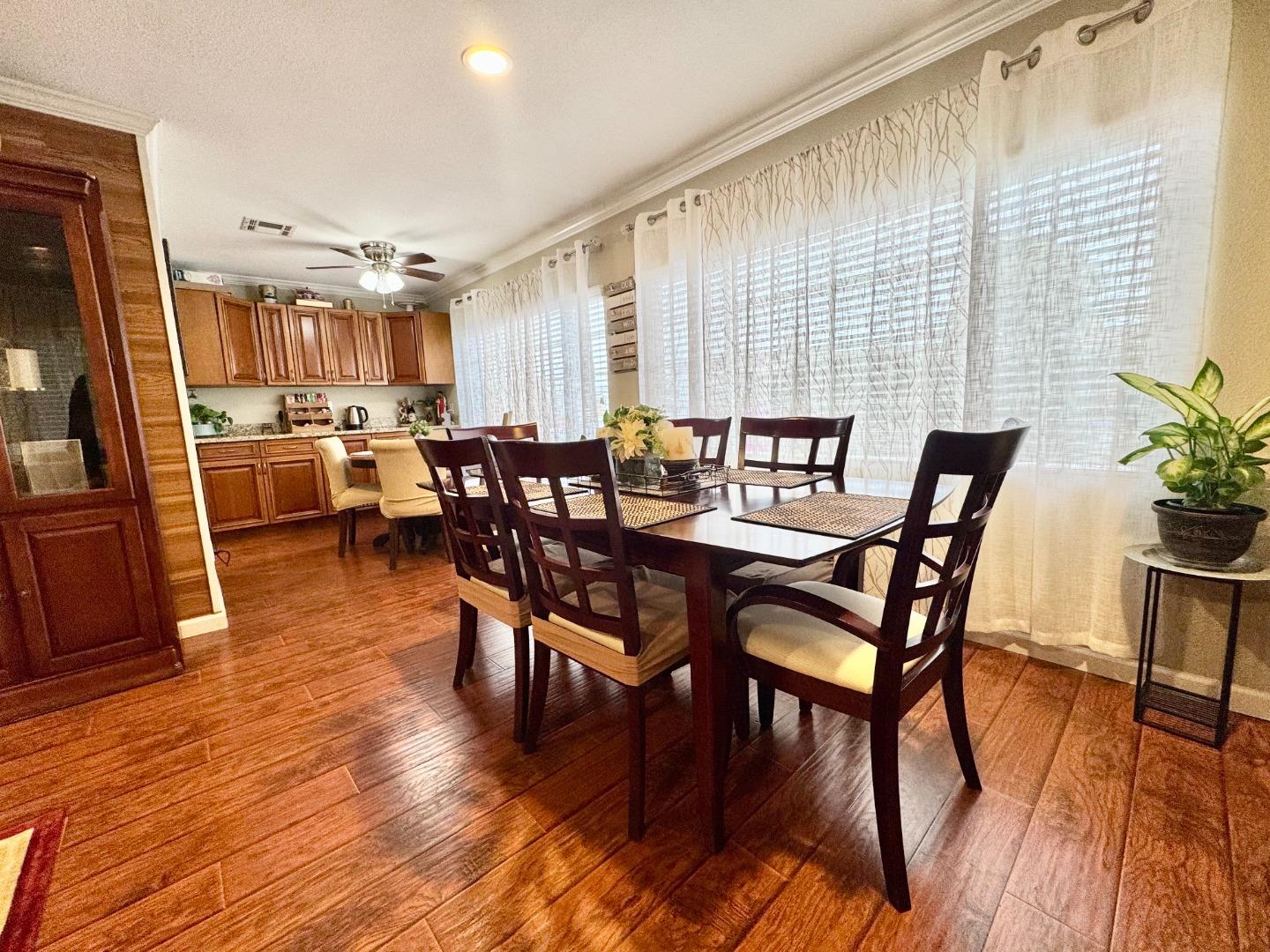 2151 Oakland Road, Unit 22 San Jose, CA 95131 - Photo 3 of 12 a view of a dining room with furniture window and wooden floor