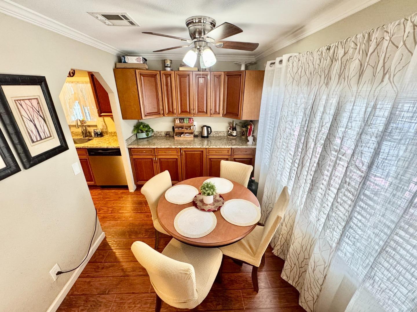 2151 Oakland Road, Unit 22 San Jose, CA 95131 - Photo 5 of 12 a view of a dining room with furniture and wooden floor