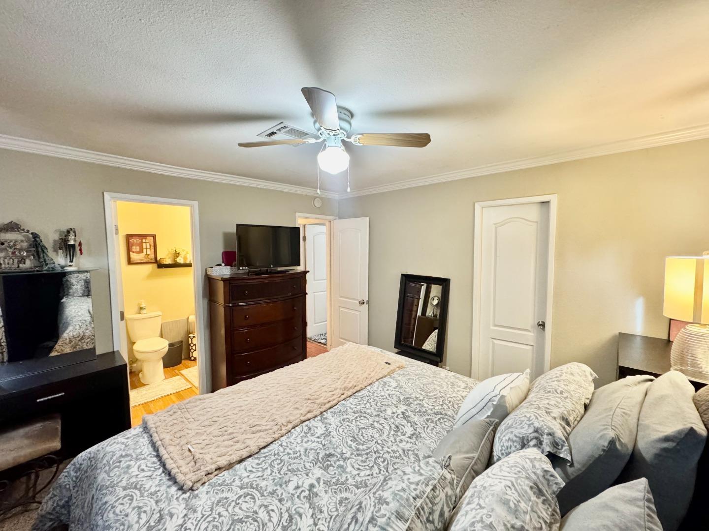 2151 Oakland Road, Unit 22 San Jose, CA 95131 - Photo 9 of 12 a bedroom with a bed and a flat screen tv