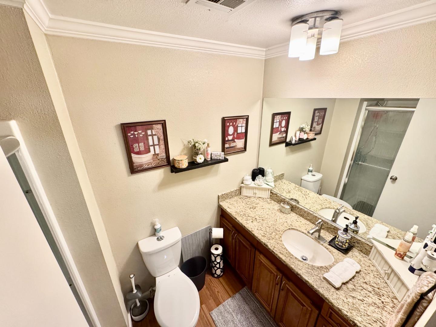 2151 Oakland Road, Unit 22 San Jose, CA 95131 - Photo 10 of 12 a bathroom with a sink vanity mirror and toilet