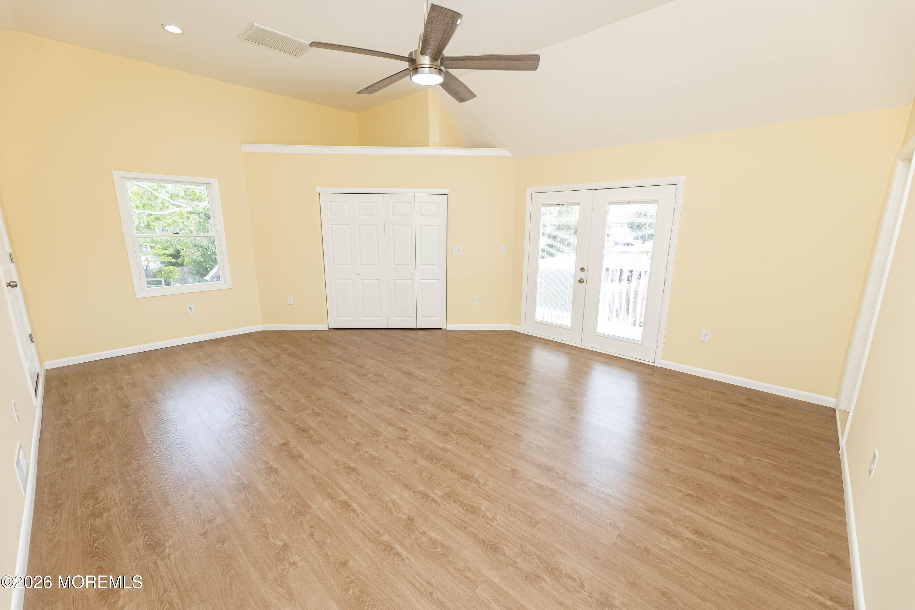 2408 Herbertsville Road Point Pleasant, NJ 08742 - Photo 30 of 82 a view of an empty room with wooden floor and a window