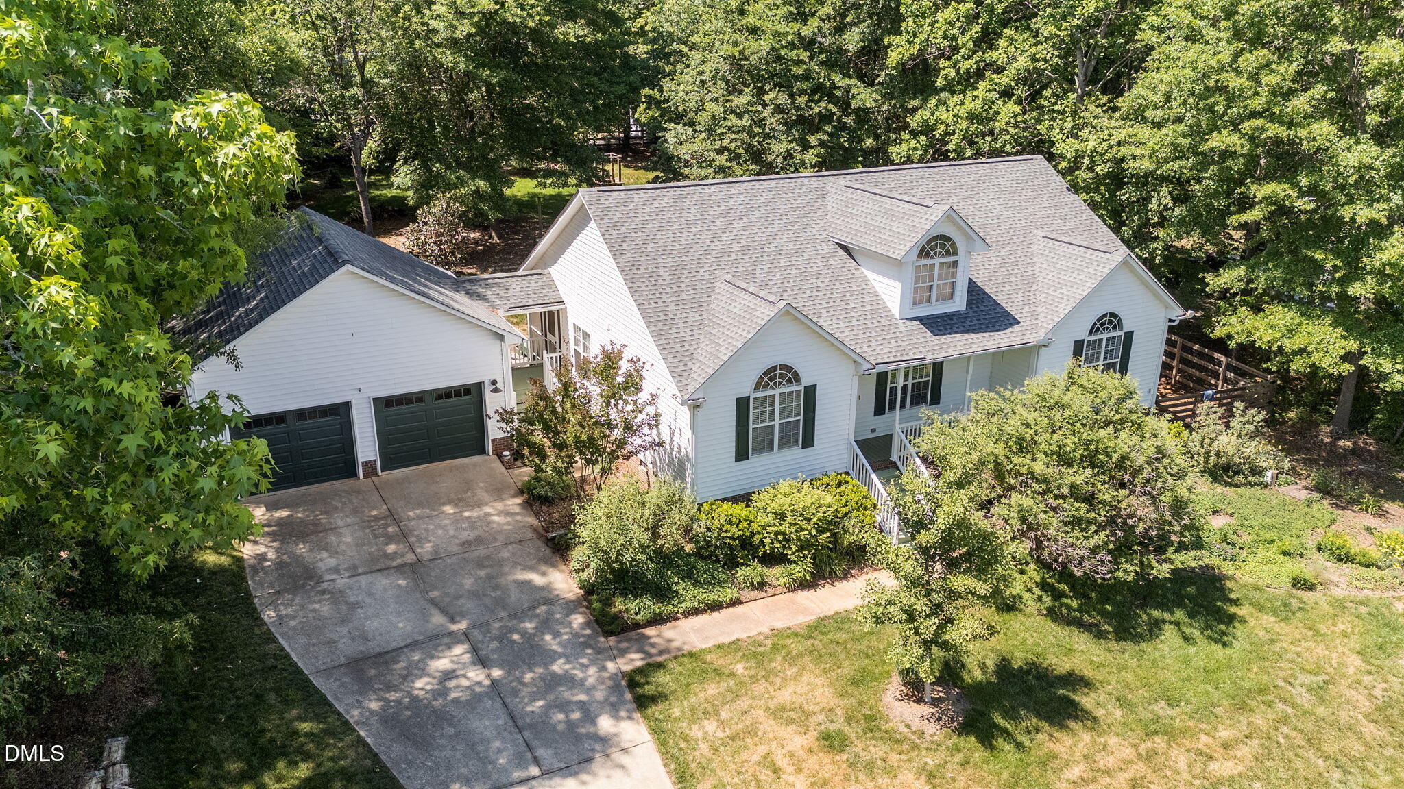 6820 Oviedo Drive Raleigh, NC 27603 - Photo 2 of 50 a aerial view of a house with a yard and large trees