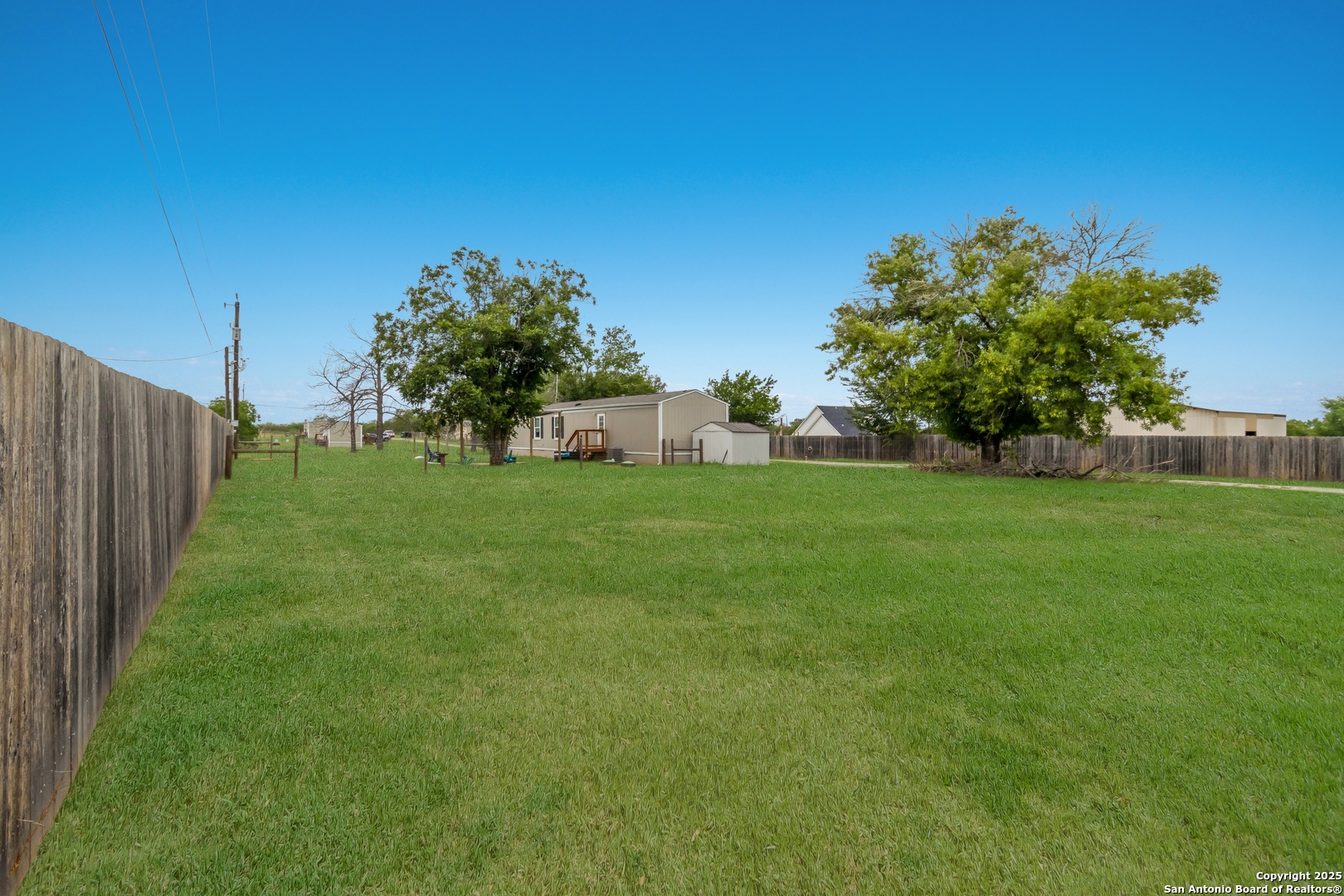 7380 Pittman Road Adkins, TX 78101 - Photo 11 of 16 a view of a backyard with a garden