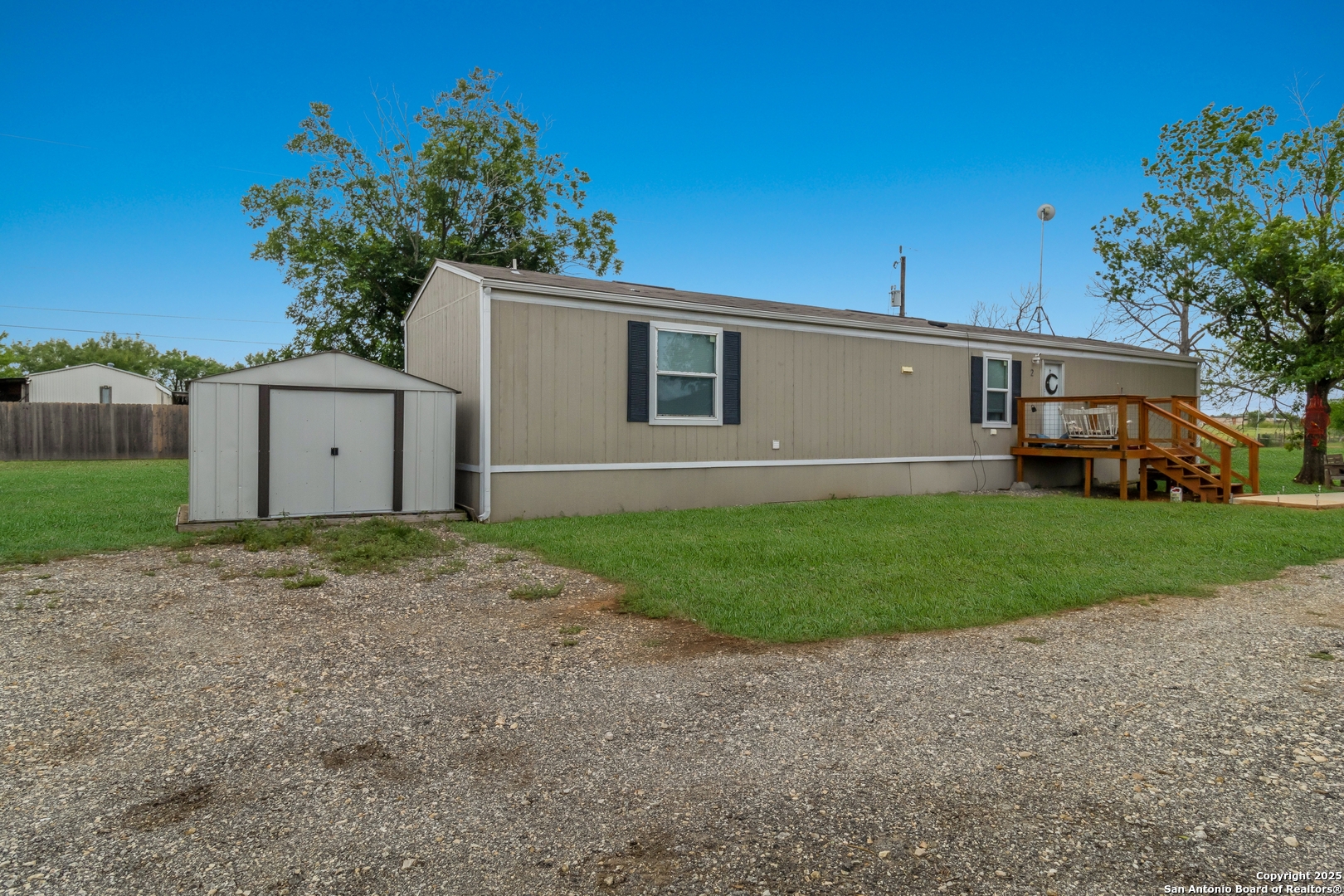 7380 Pittman Road Adkins, TX 78101 - Photo 6 of 16 a view of a house with a garden and yard