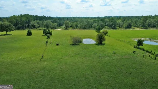 a view of a house with a big yard