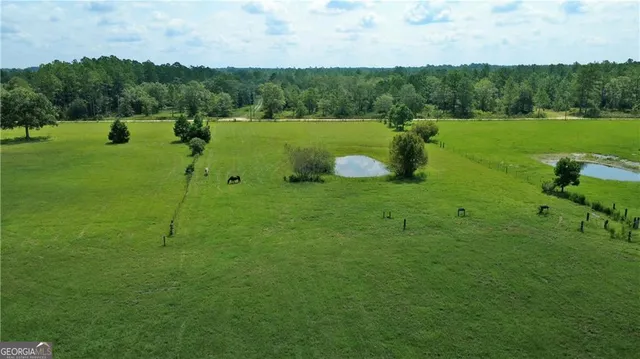 a view of a house with a big yard