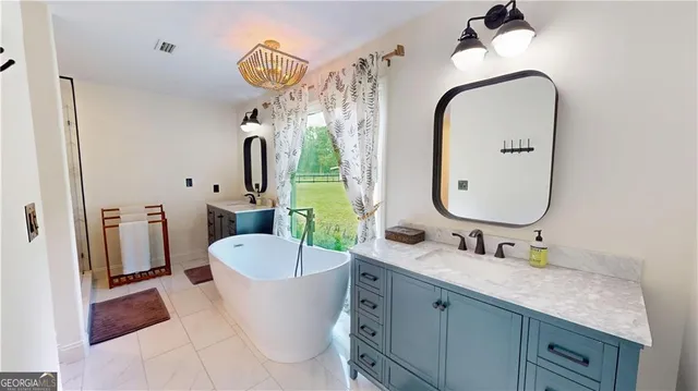 a bedroom with furniture and a window