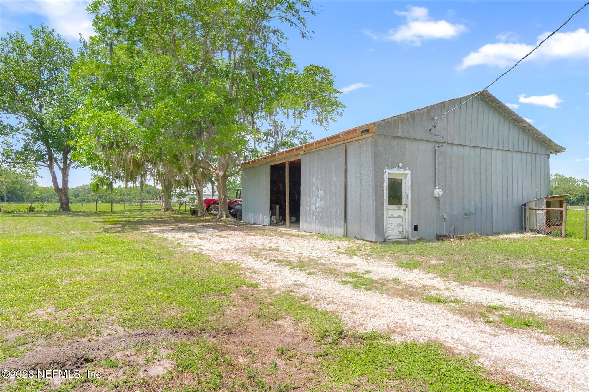 786 West River Road Palatka, FL 32177 - Photo 4 of 53 a view of a house with a yard and tree