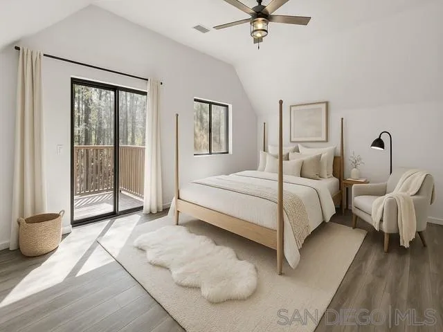 21838 Crestline Road Palomar Mountain, CA 92060 - Photo 11 of 26 a bedroom with a bed and a large window