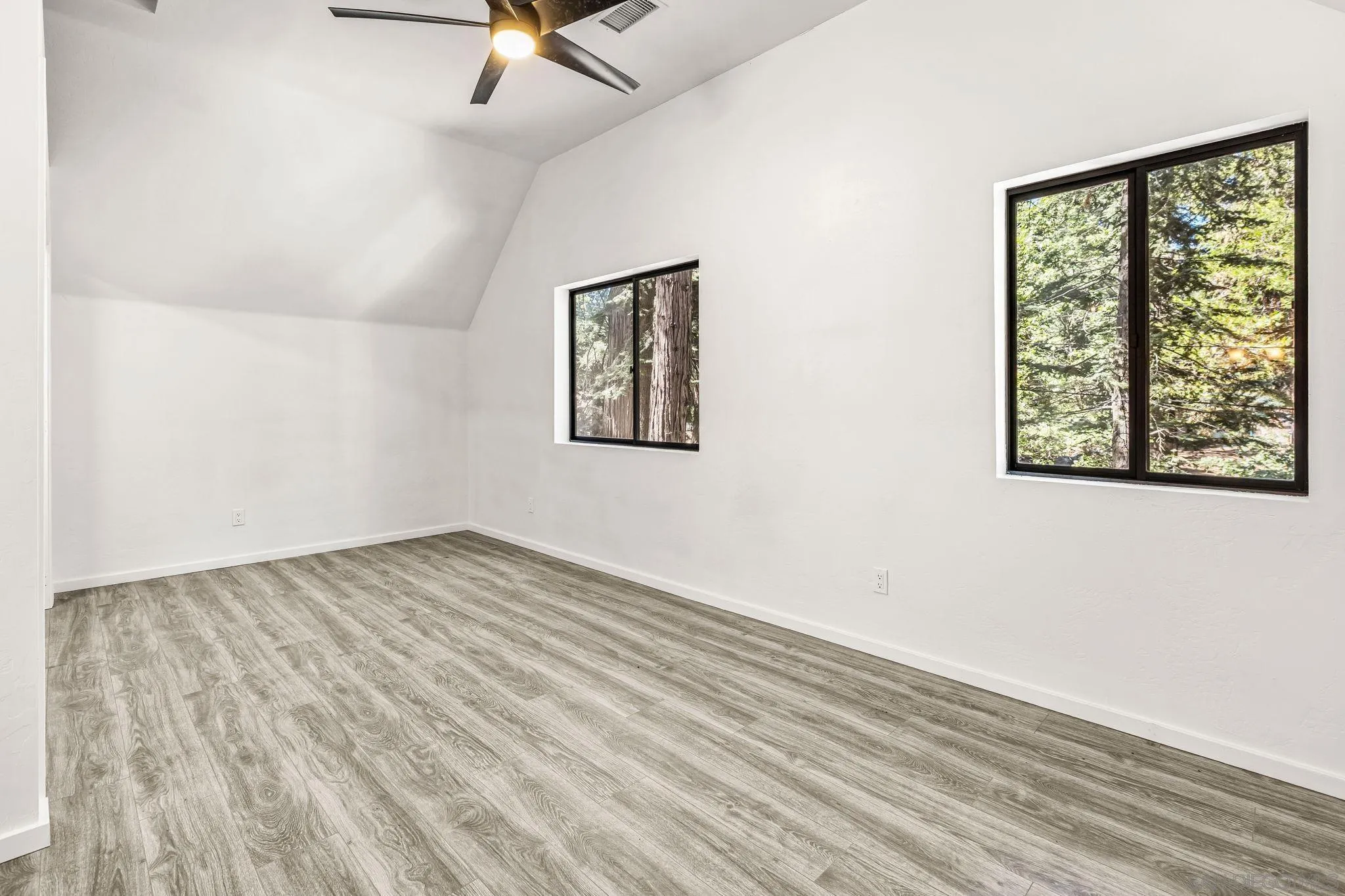 21838 Crestline Road Palomar Mountain, CA 92060 - Photo 15 of 26 wooden floor in an empty room with a window