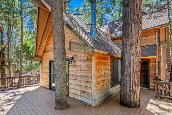 a view of front door and deck of the house