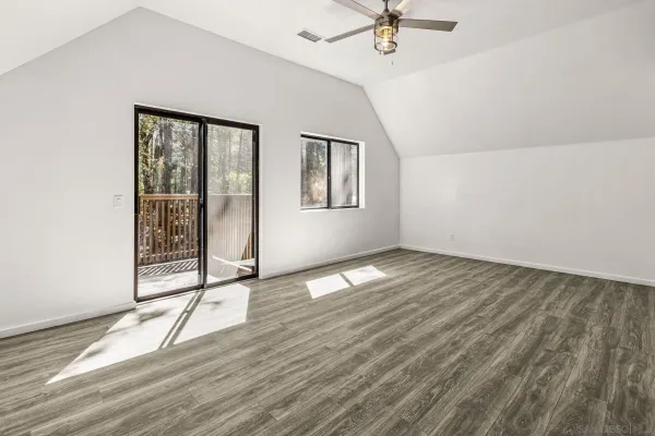 a view of an empty room with a window