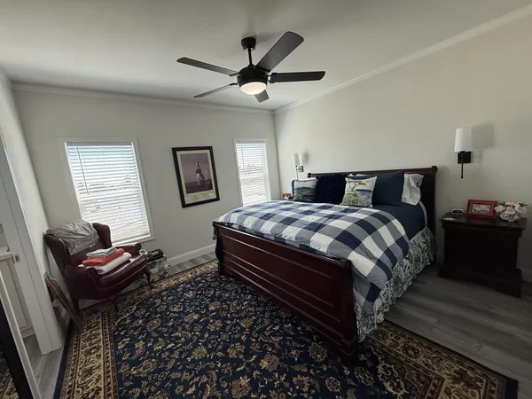 a bedroom with bed and a window