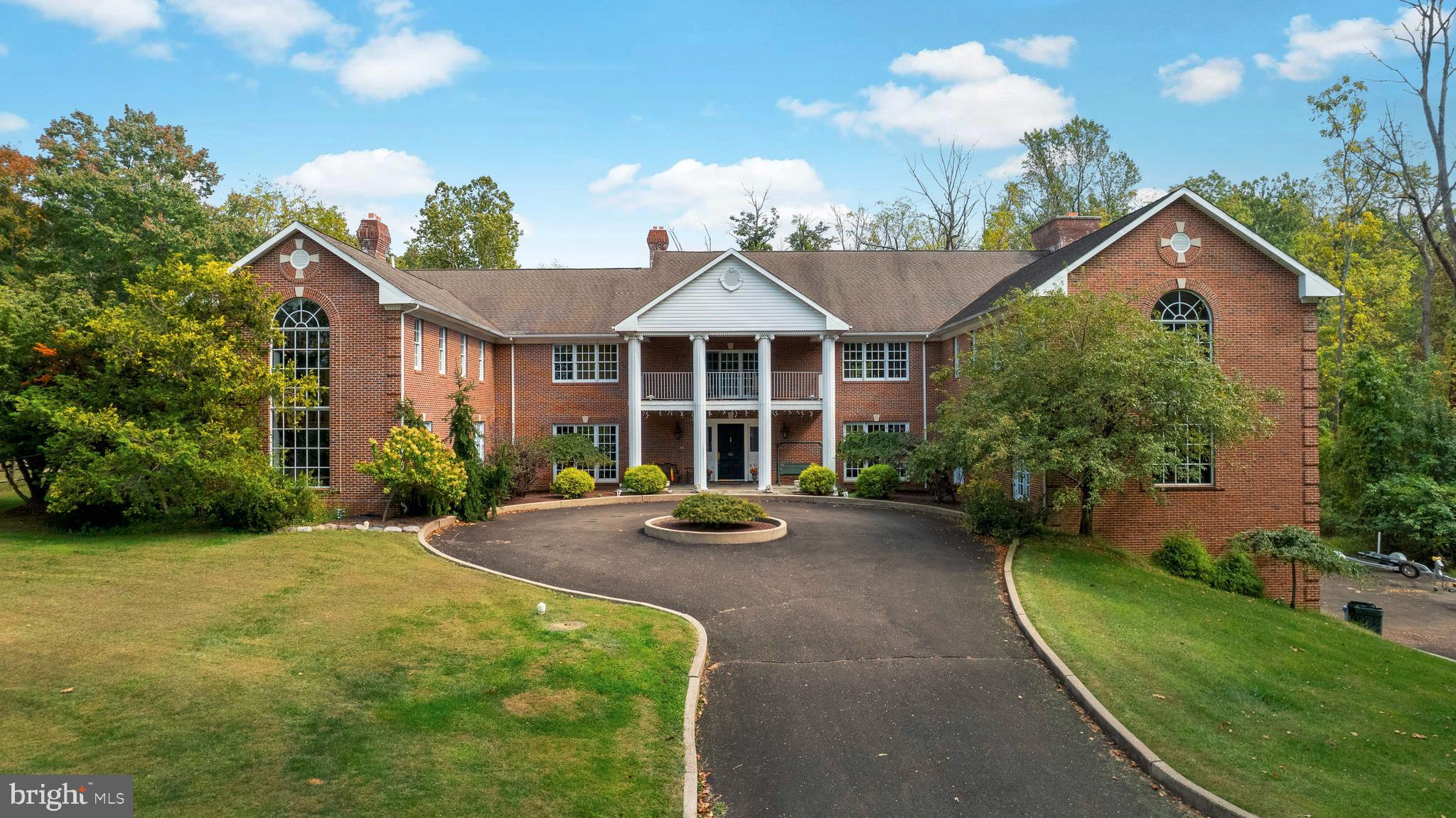 a view of a house with sitting area and garden