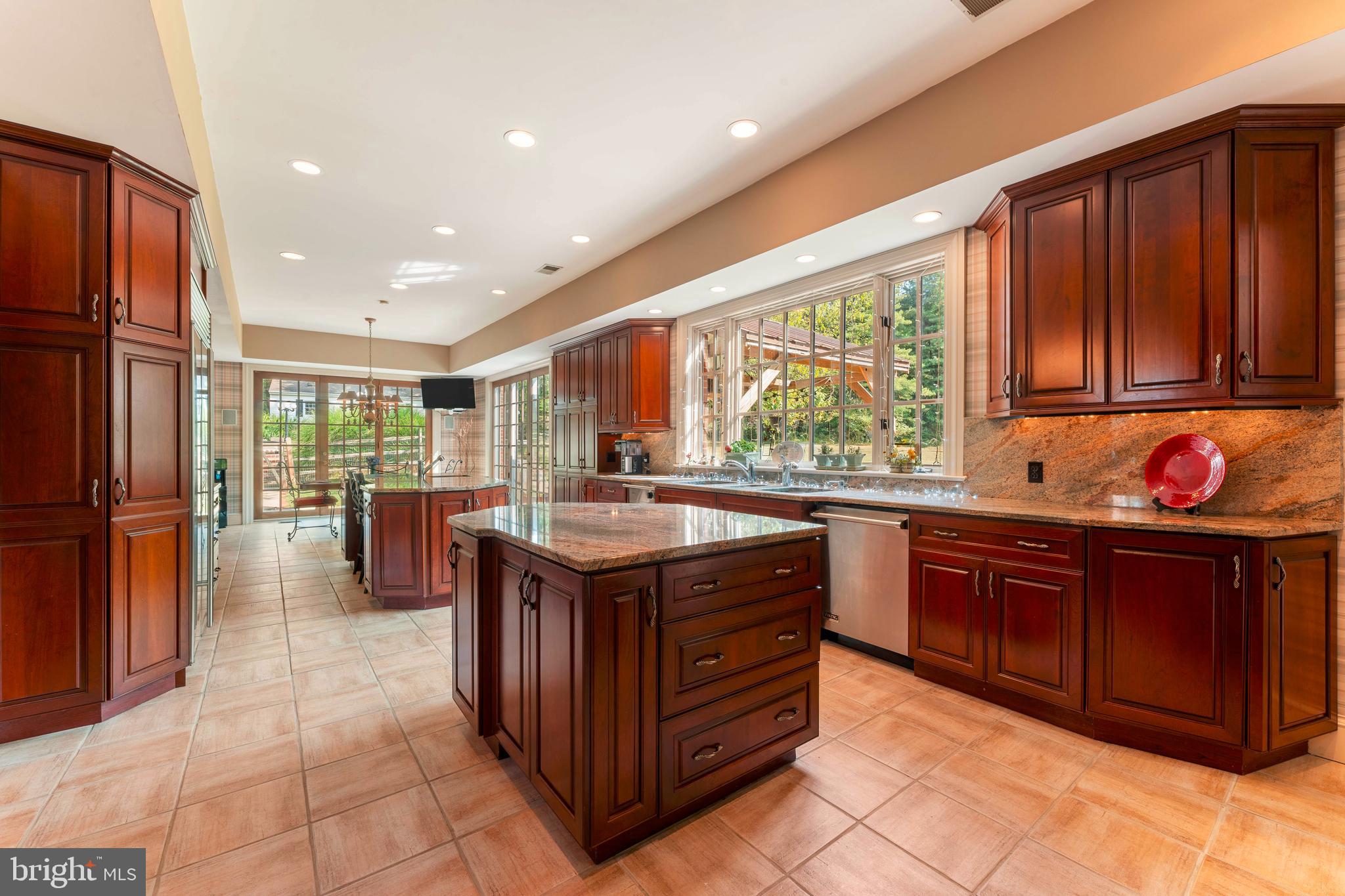 1390 Old Jacksonville Road Ivyland, PA 18974 - Photo 12 of 75 a kitchen with stainless steel appliances granite countertop a stove a sink and a refrigerator