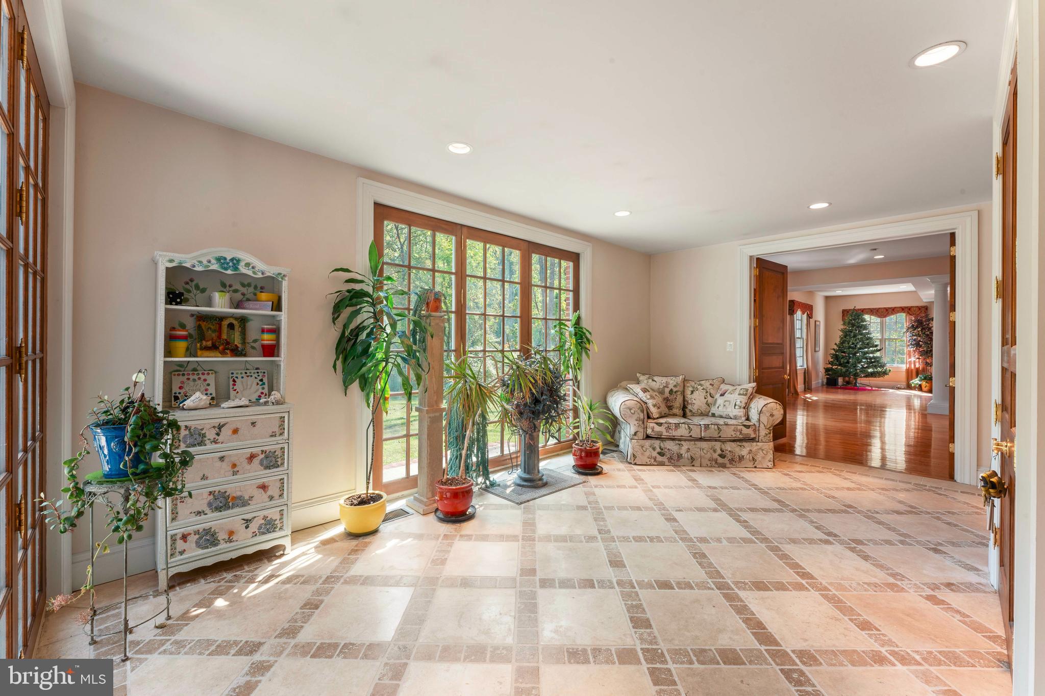 1390 Old Jacksonville Road Ivyland, PA 18974 - Photo 19 of 75 a living room with furniture floor to ceiling window and potted plants