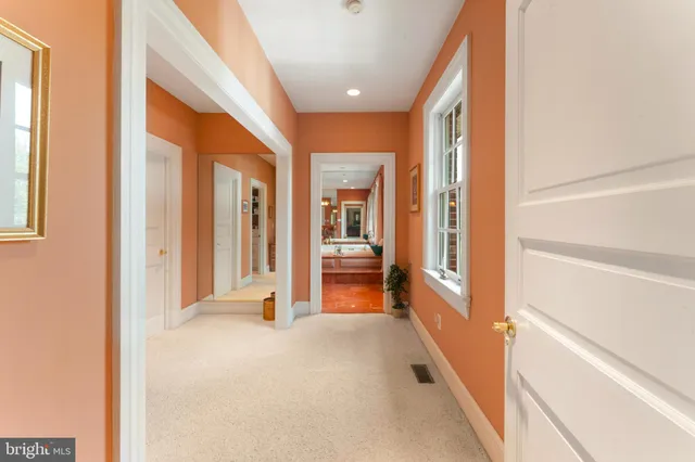 a large room with a large window and furniture