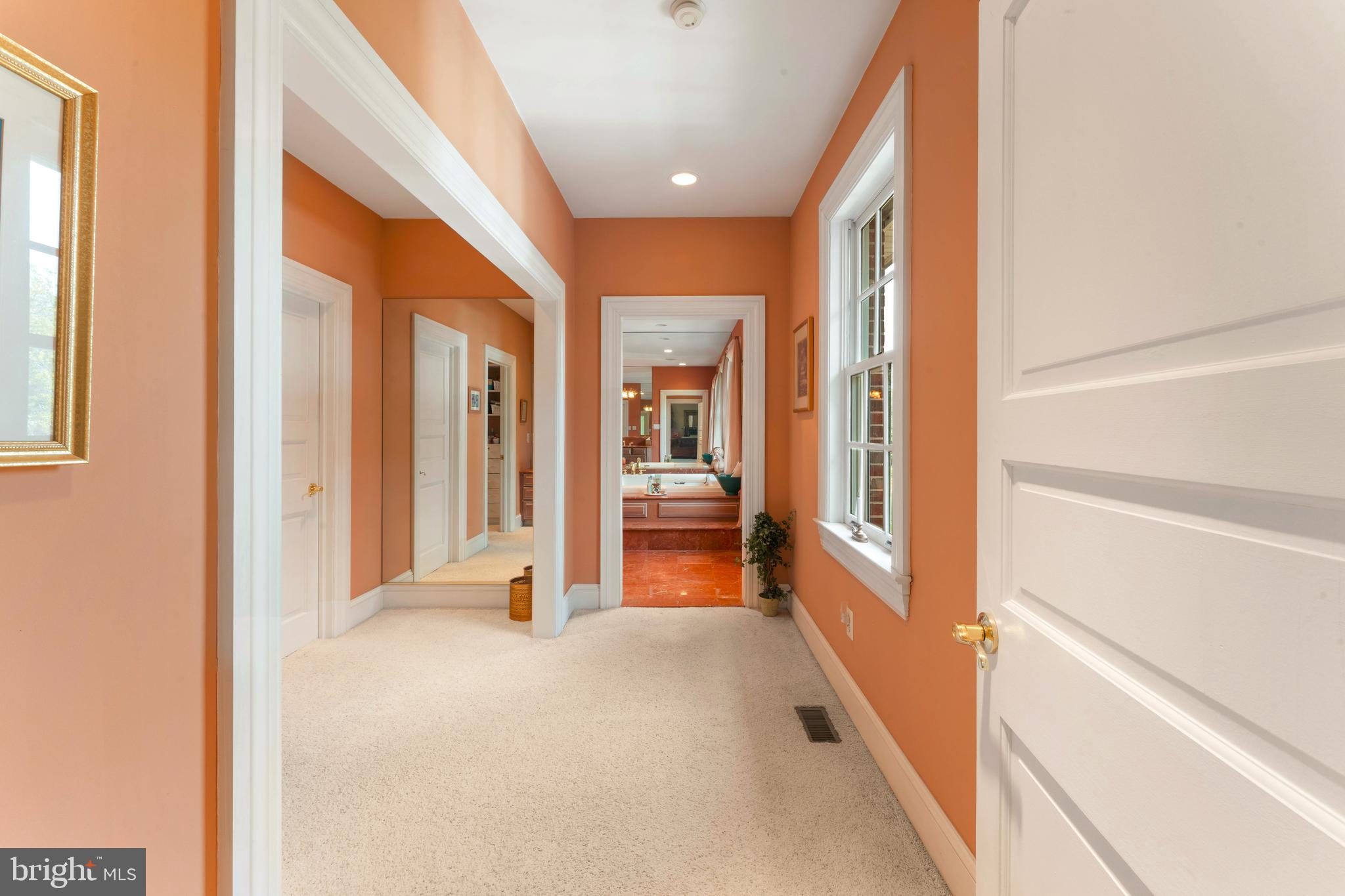 1390 Old Jacksonville Road Ivyland, PA 18974 - Photo 35 of 75 a view of a hallway with wooden floor and windows