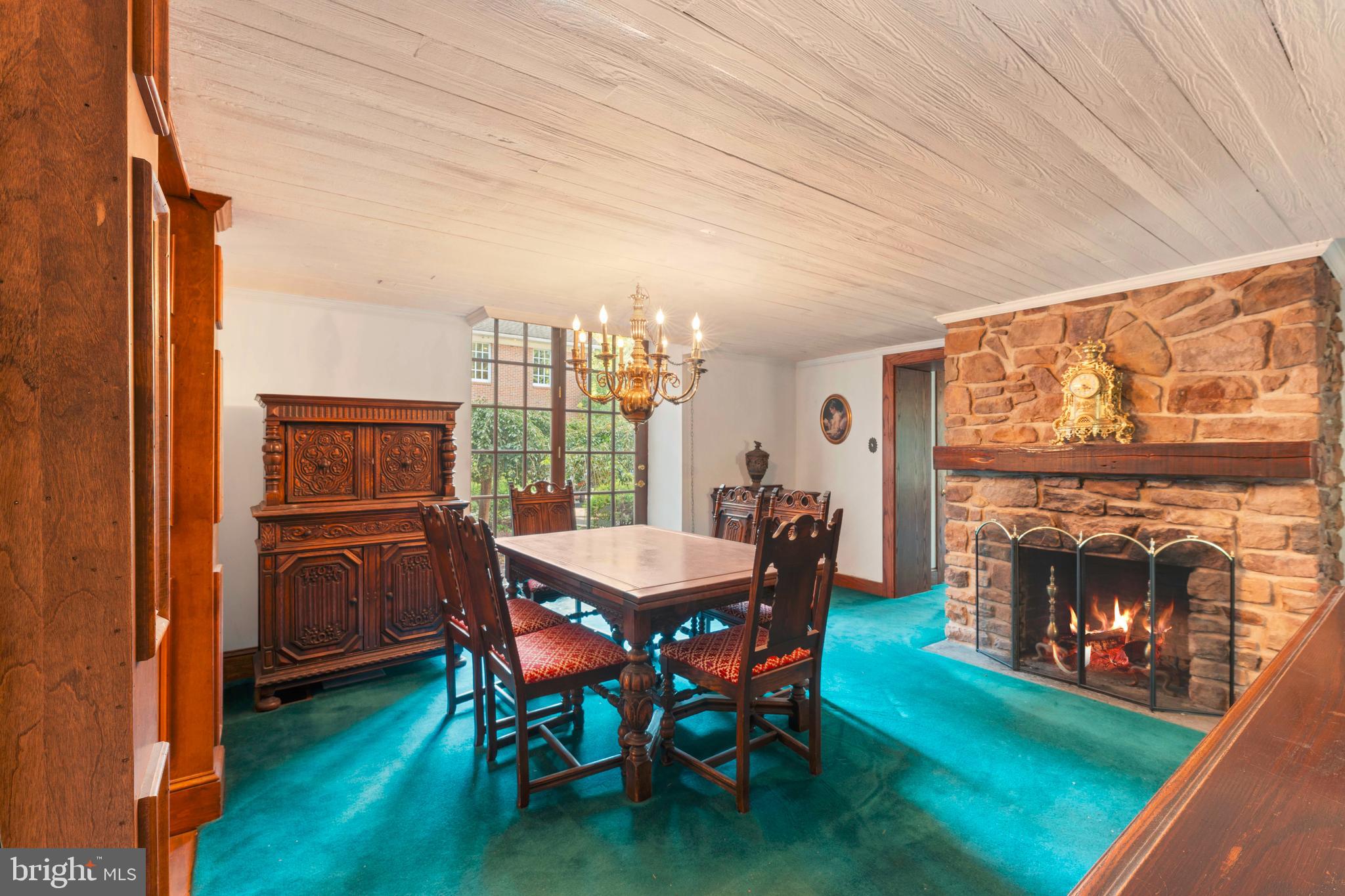 1390 Old Jacksonville Road Ivyland, PA 18974 - Photo 48 of 75 a dining room with furniture a fireplace and wooden floor