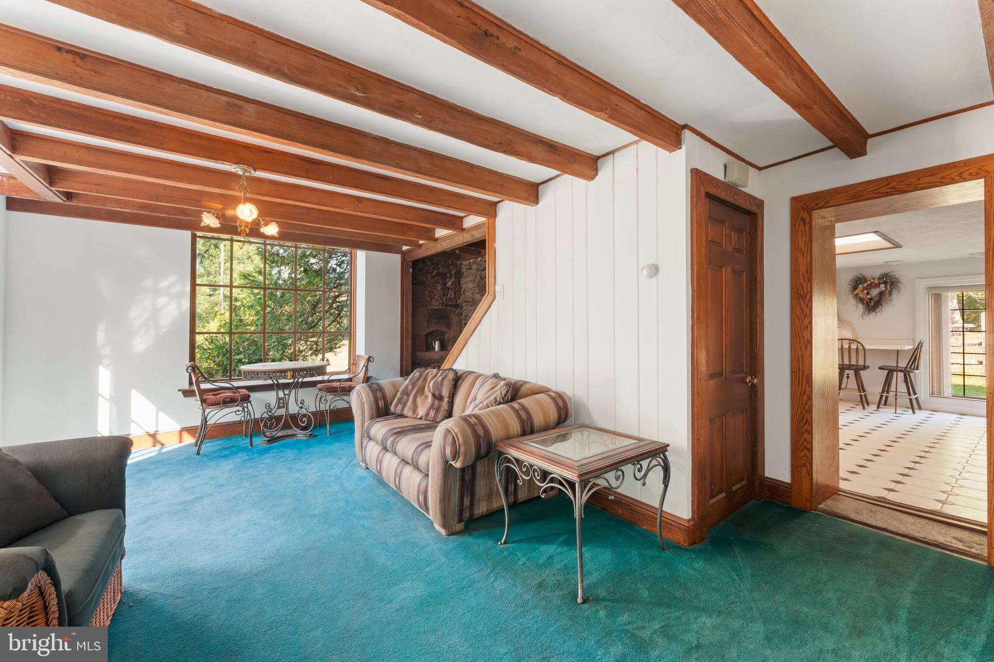 1390 Old Jacksonville Road Ivyland, PA 18974 - Photo 53 of 75 a living room with furniture and a floor to ceiling window