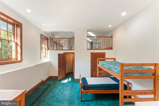 a view of a house with backyard porch and sitting area