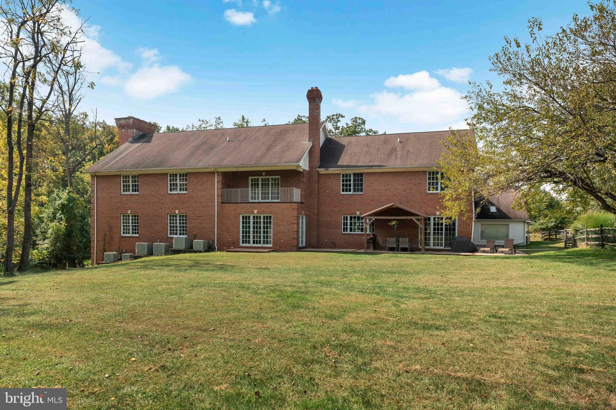 1390 Old Jacksonville Road Ivyland, PA 18974 - Photo 60 of 75 a front view of a house with a garden and trees