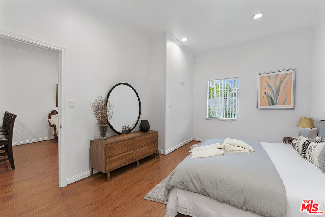 1430 North Dominion Avenue Pasadena, CA 91104 - Photo 18 of 25 a bedroom with bed and a large window