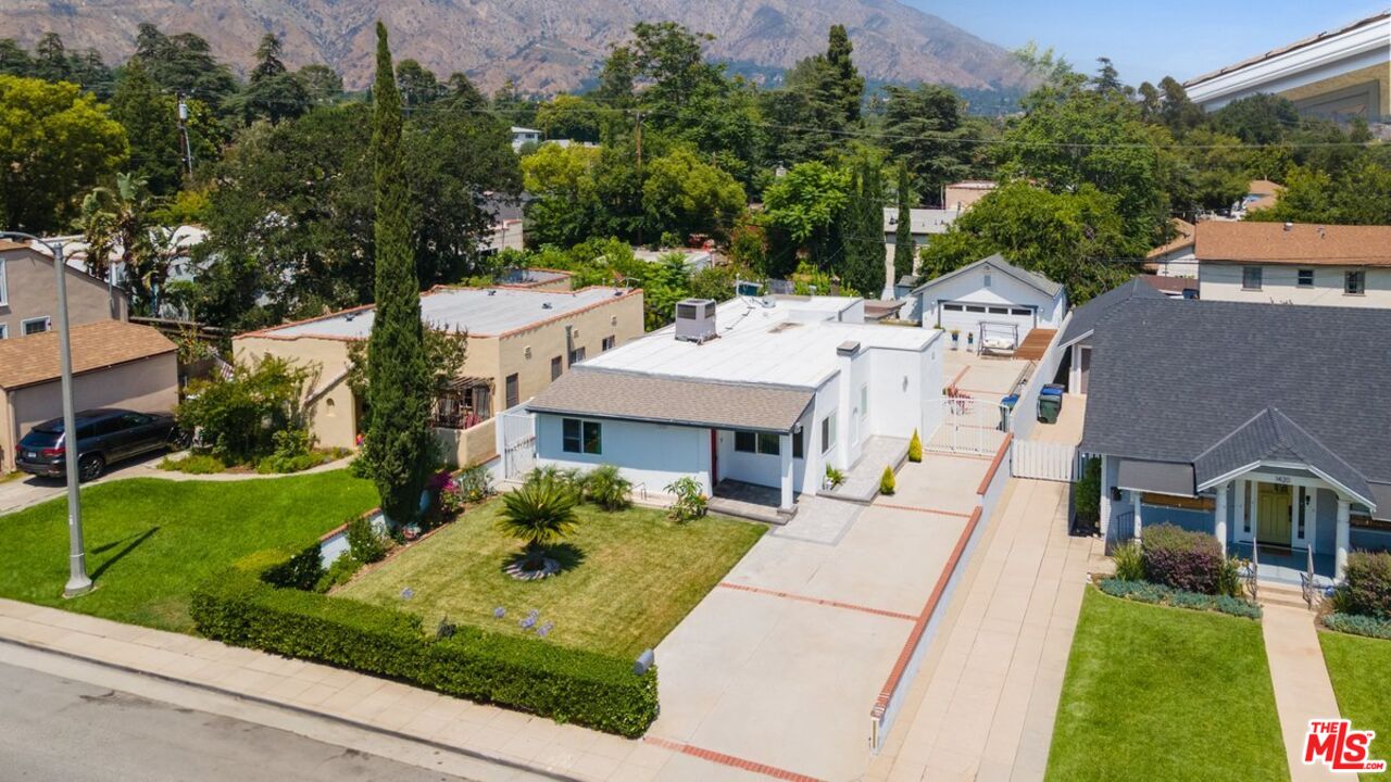 1430 North Dominion Avenue Pasadena, CA 91104 - Photo 21 of 25 aerial view of a house with a yard table and chairs