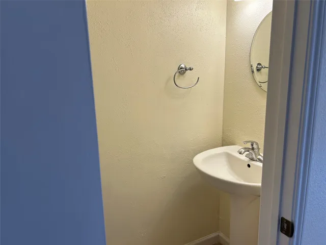 a bathroom with a sink and mirror