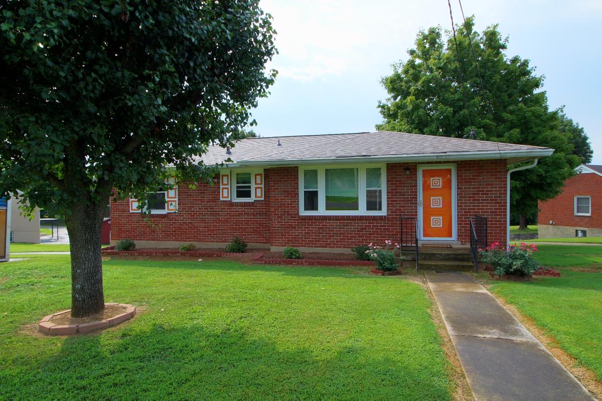 1032 Mitchell Road Nashville, TN 37206 - Photo 3 of 23 a front view of a house with a garden and trees