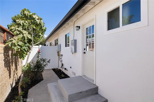 a backyard of a house with outdoor seating