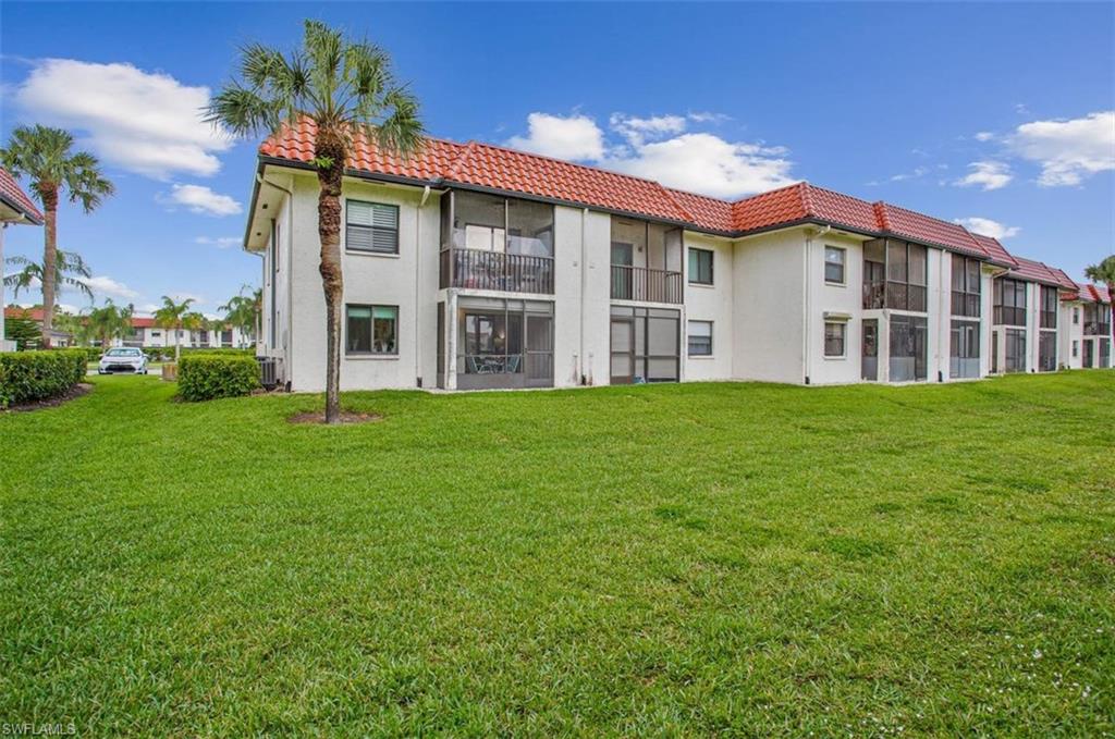 4258 27th Court Southwest, Unit 106 Naples, FL 34116 - Photo 17 of 19 Back screen in lanai houses your laundry center