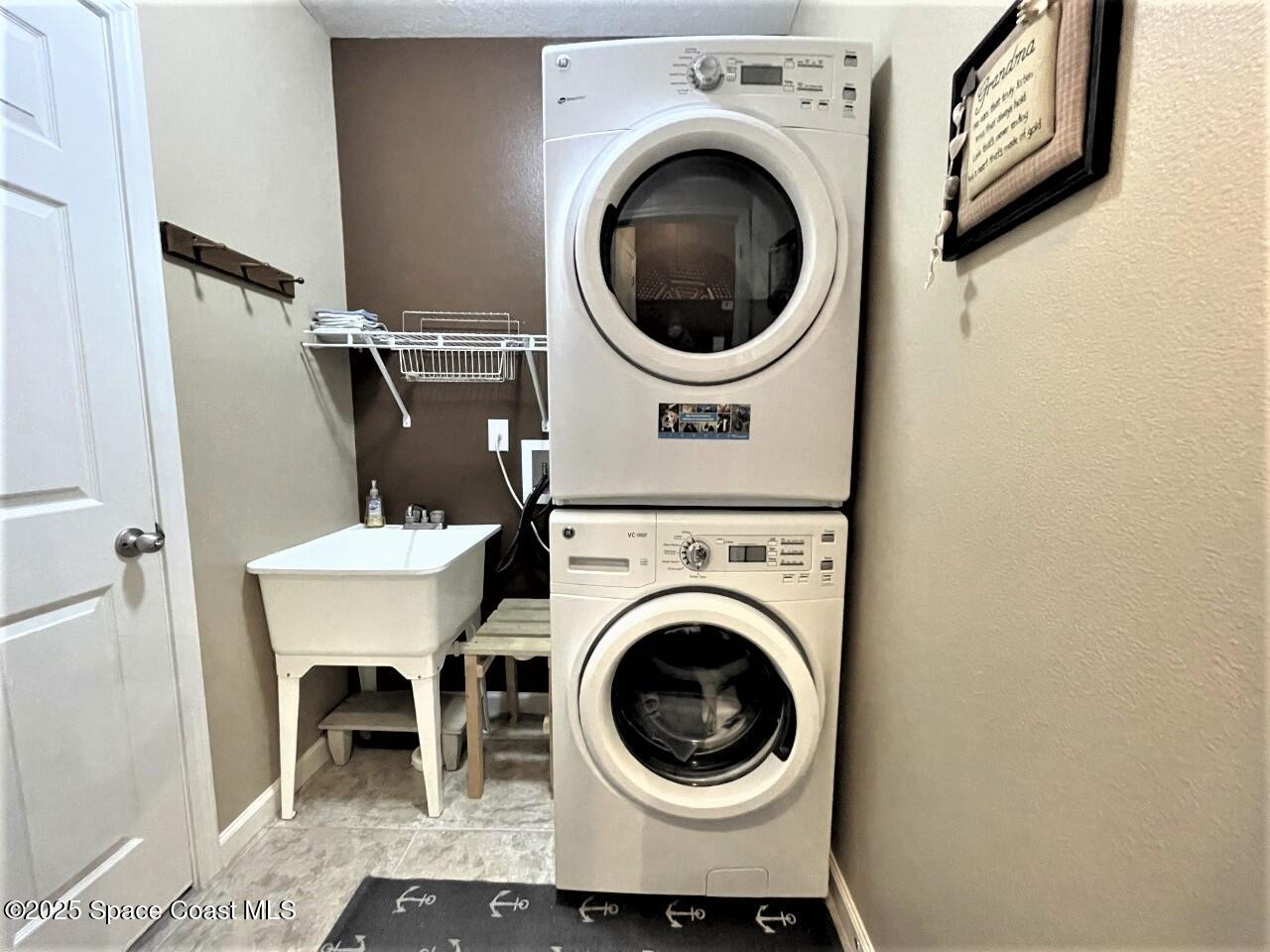 217 Briarcliff Circle Sebastian, FL 32958 - Photo 11 of 36 a view of a hallway with washer and dryer