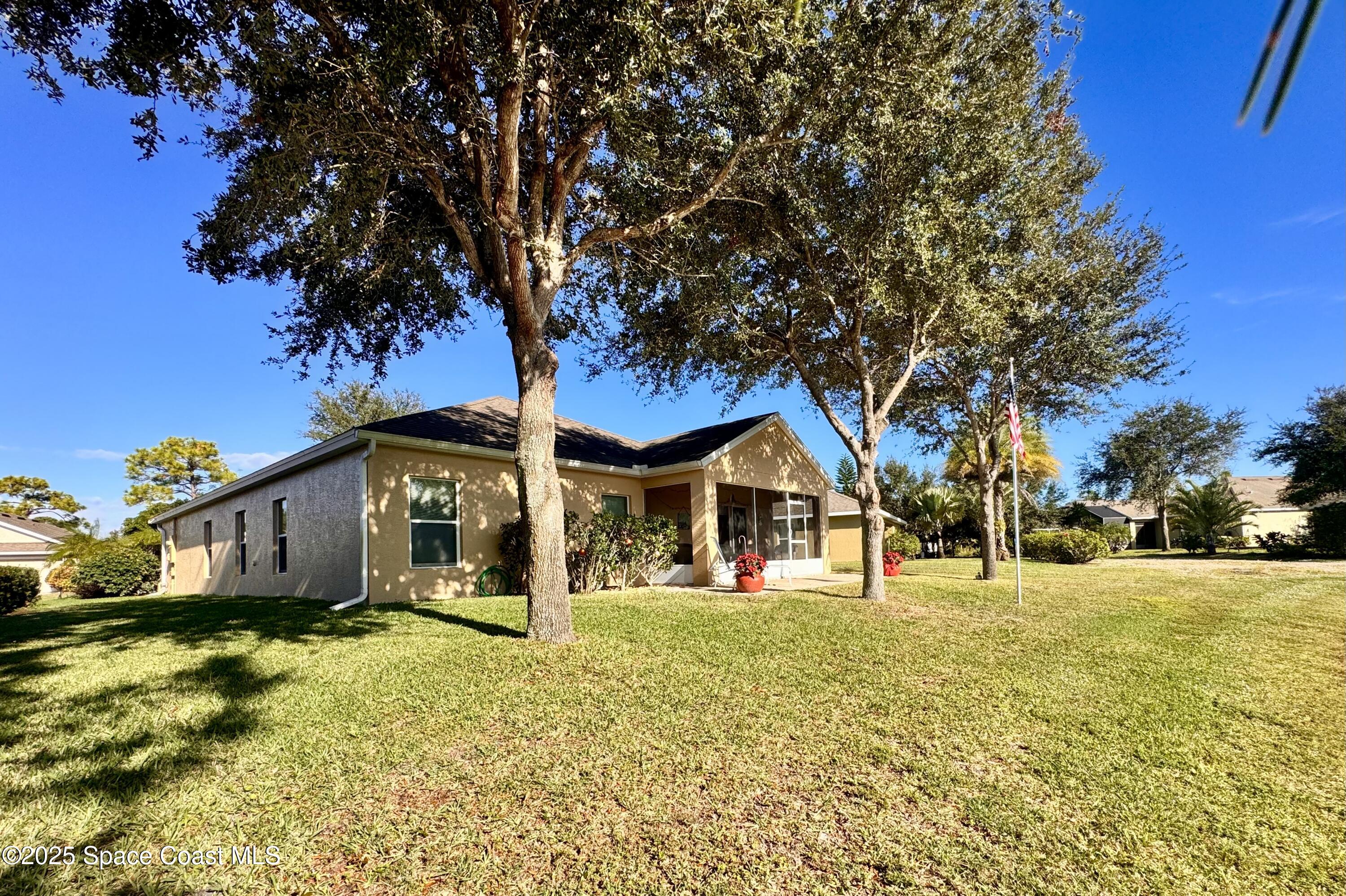 217 Briarcliff Circle Sebastian, FL 32958 - Photo 12 of 36 a front view of a house with a yard