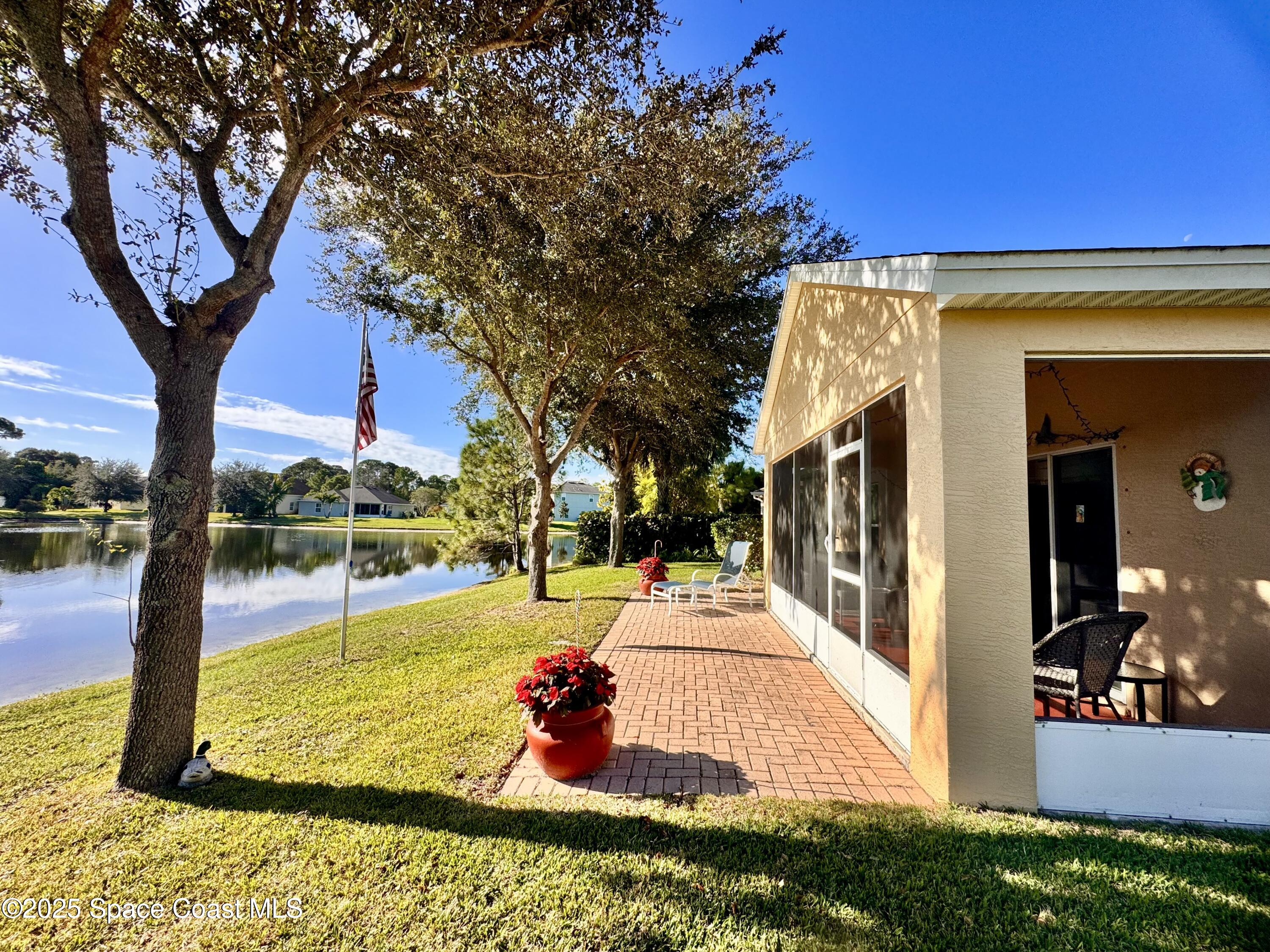 217 Briarcliff Circle Sebastian, FL 32958 - Photo 16 of 36 a view of a backyard with large trees