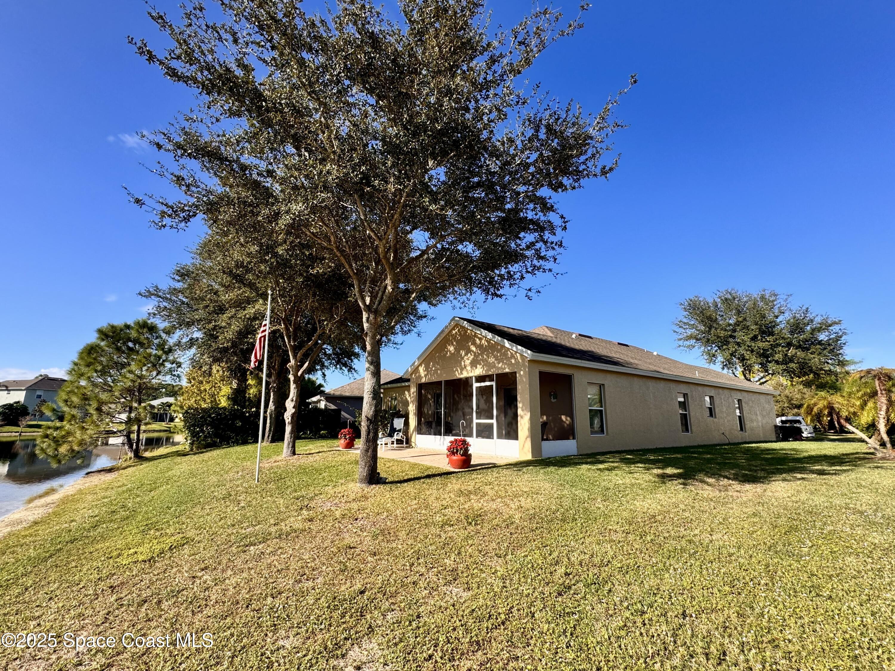 217 Briarcliff Circle Sebastian, FL 32958 - Photo 17 of 36 a view of a house with a large tree