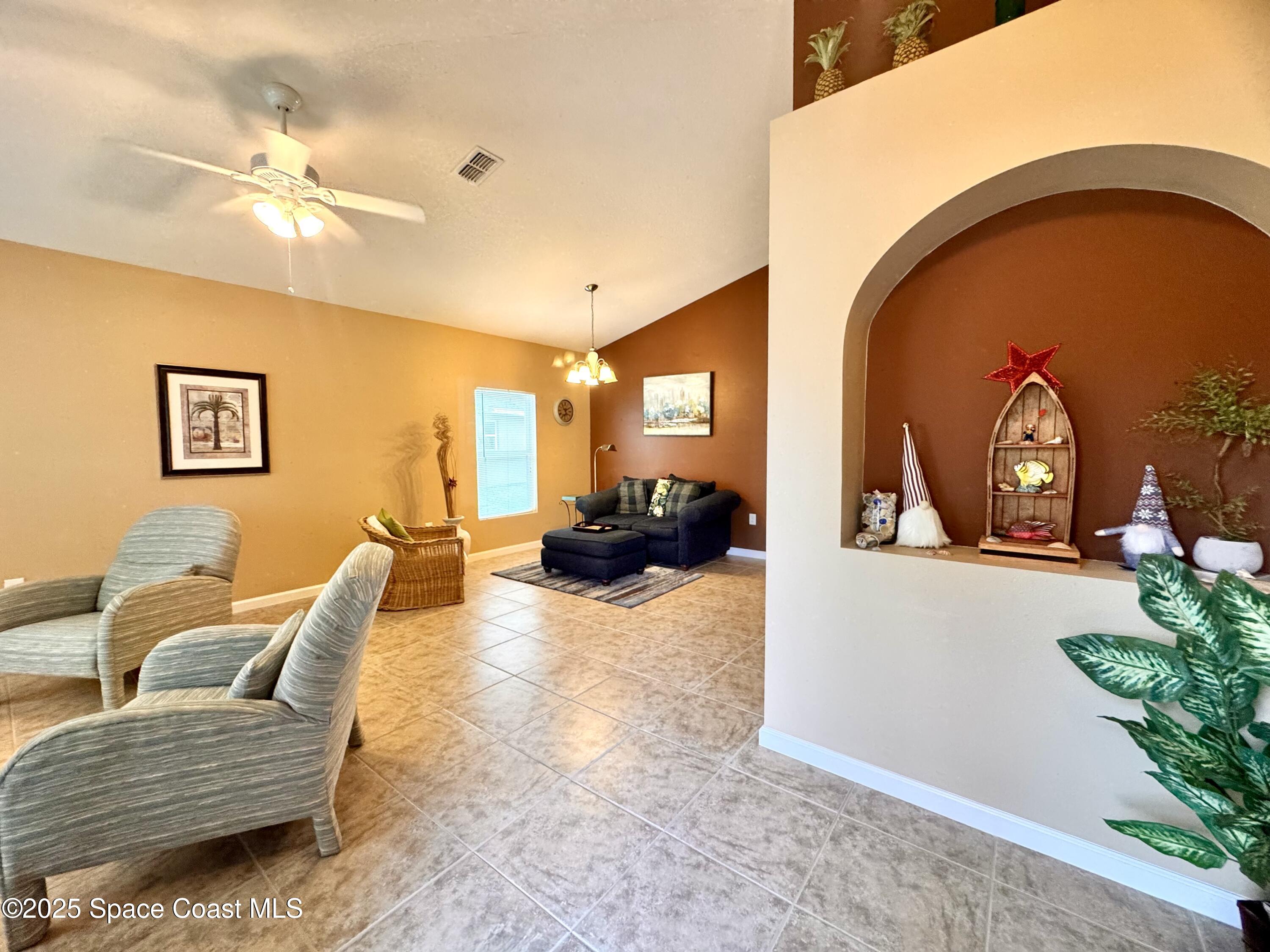 217 Briarcliff Circle Sebastian, FL 32958 - Photo 21 of 36 a living room with furniture and a potted plant