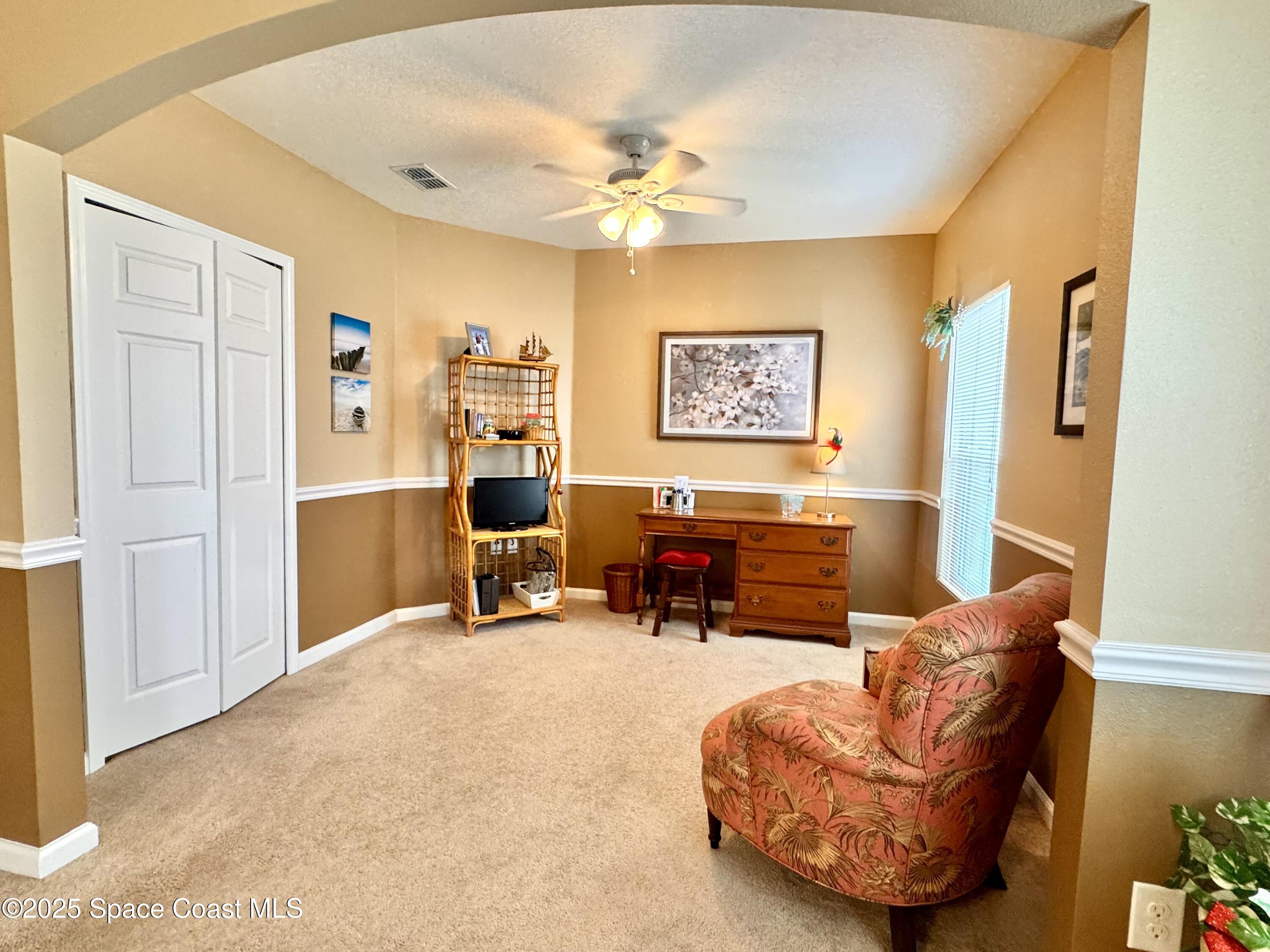 217 Briarcliff Circle Sebastian, FL 32958 - Photo 26 of 36 a view of a livingroom with workspace and a couch