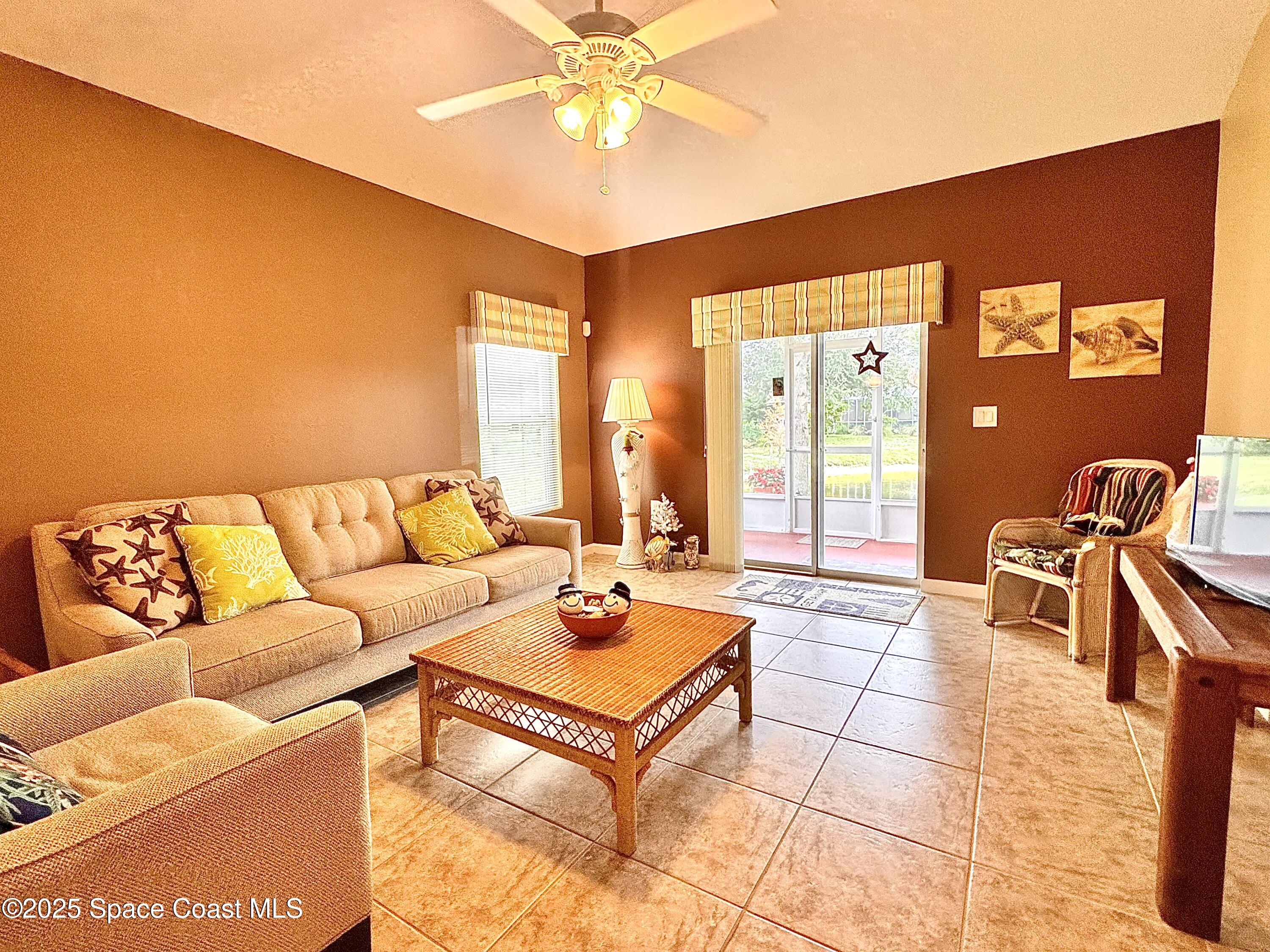 217 Briarcliff Circle Sebastian, FL 32958 - Photo 34 of 36 a living room with furniture and a large window