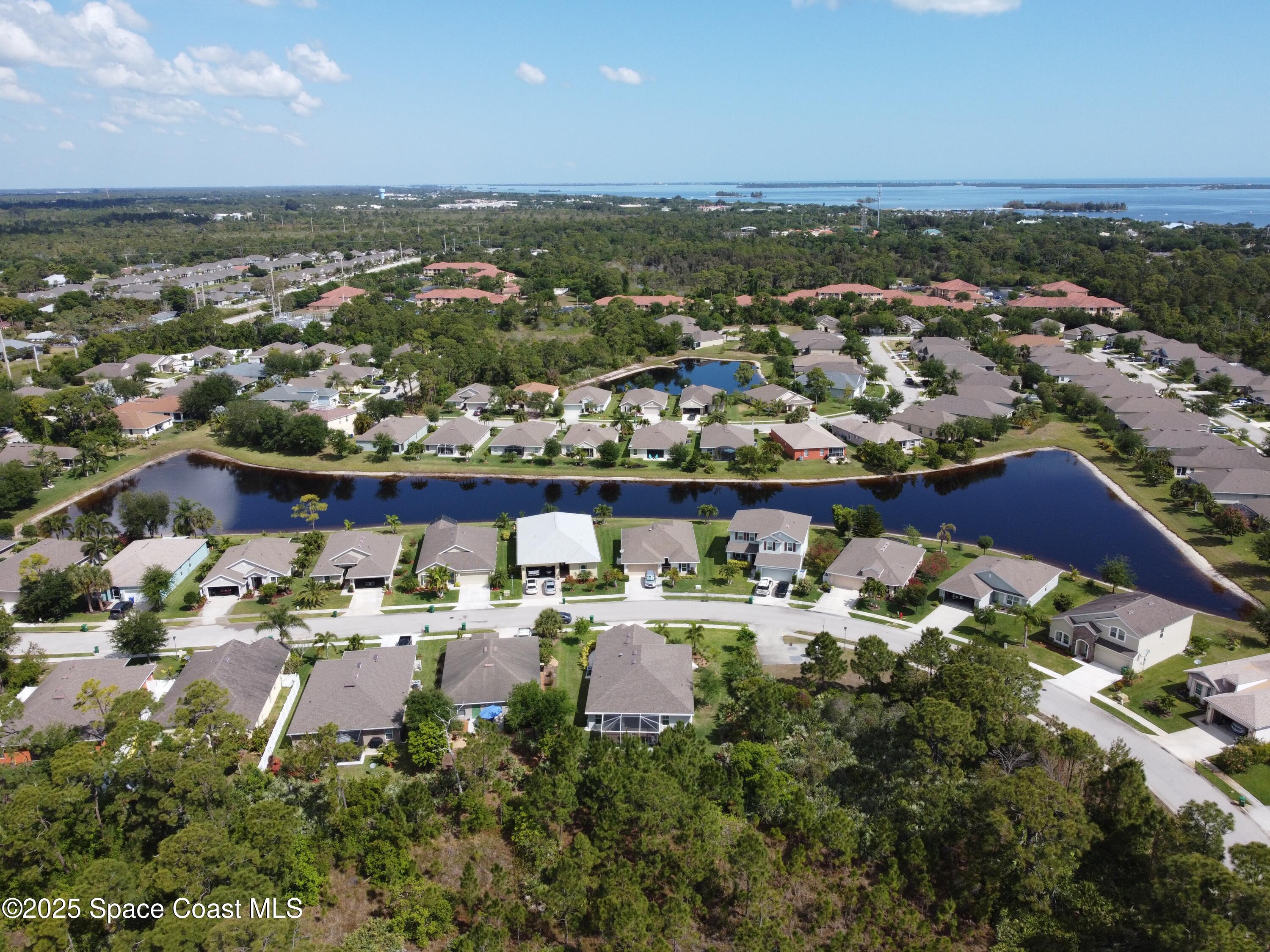 217 Briarcliff Circle Sebastian, FL 32958 - Photo 6 of 36 an aerial view of a houses with a lake