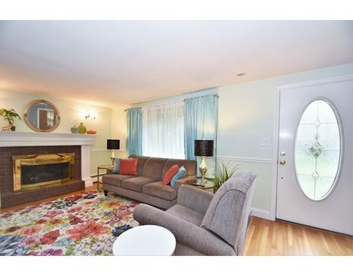 201 Cart Path Road Tewksbury, MA 01876 - Photo 11 of 29 a living room with furniture a fireplace and a flat screen tv