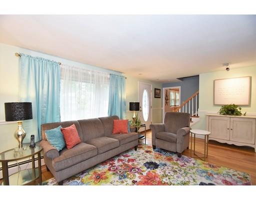 201 Cart Path Road Tewksbury, MA 01876 - Photo 12 of 29 a living room with furniture and a flat screen tv