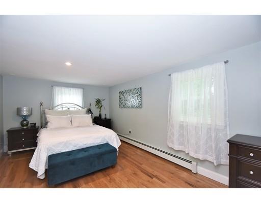 201 Cart Path Road Tewksbury, MA 01876 - Photo 17 of 29 a bedroom with a bed and a night stand