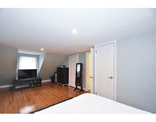 201 Cart Path Road Tewksbury, MA 01876 - Photo 19 of 29 a room with a bed and a television