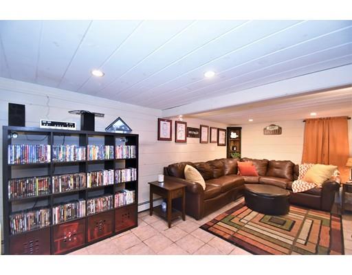 201 Cart Path Road Tewksbury, MA 01876 - Photo 24 of 29 a living room with furniture and a book shelf