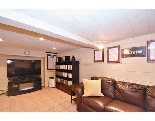 201 Cart Path Road Tewksbury, MA 01876 - Photo 25 of 29 a living room with furniture and a flat screen tv