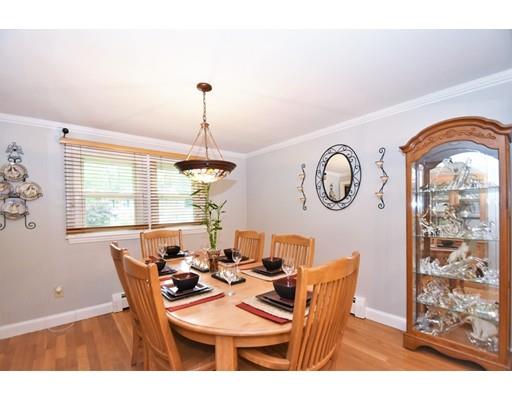 201 Cart Path Road Tewksbury, MA 01876 - Photo 7 of 29 a dining room with furniture a chandelier and a rug